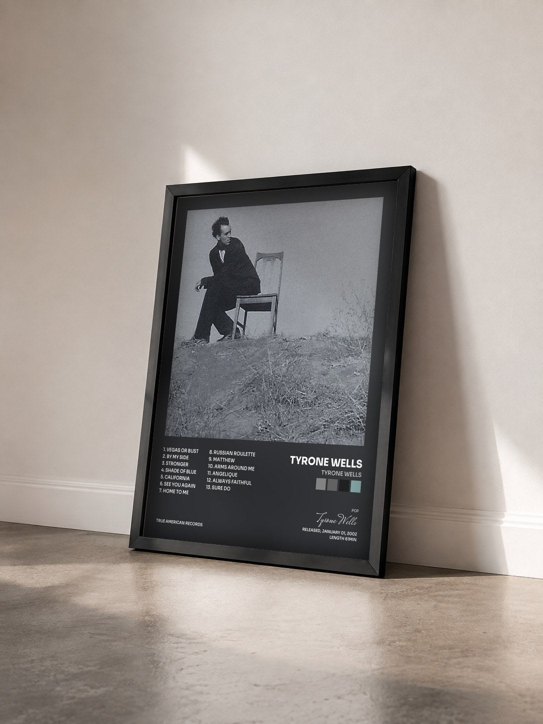 #noir Tableau de l'album Tyrone Wells de Tyrone Wells vu de trois quarts, cadre noir