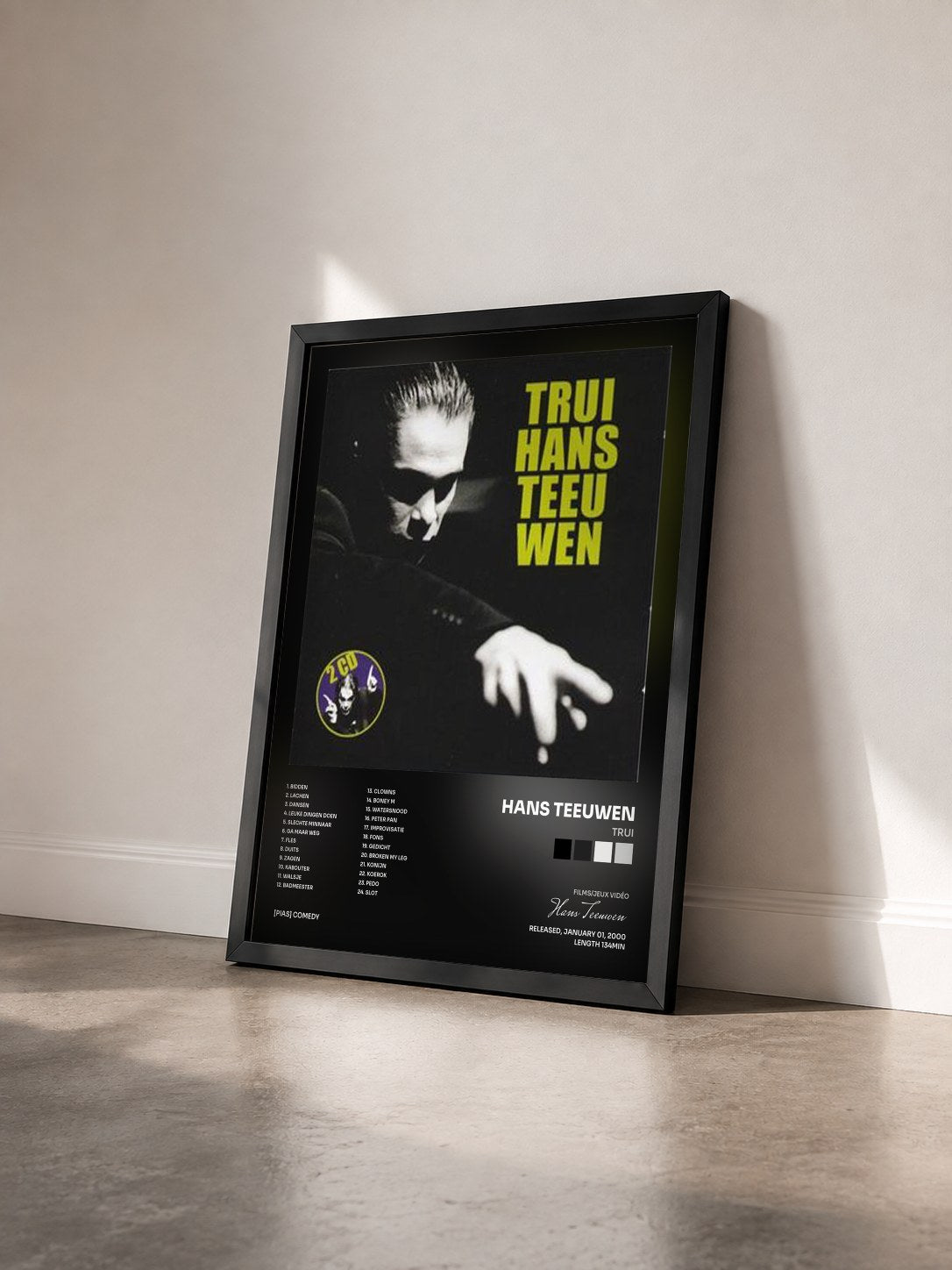 #noir Tableau de l'album Trui de Hans Teeuwen vu de trois quarts, cadre noir