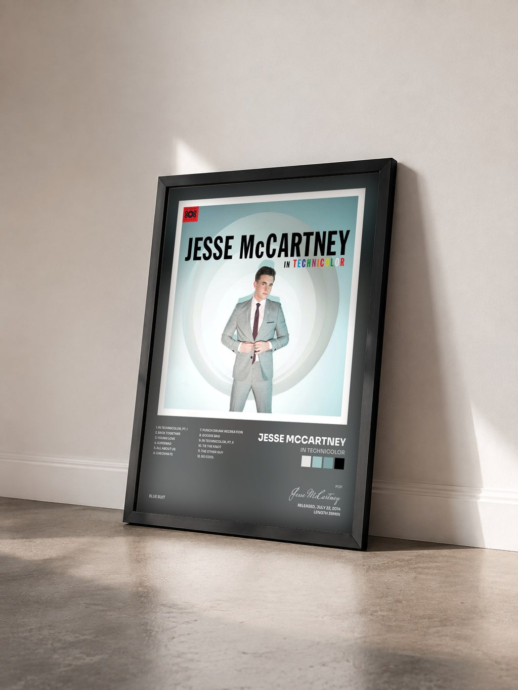 #noir Tableau de l'album In Technicolor de Jesse McCartney vu de trois quarts, cadre noir
