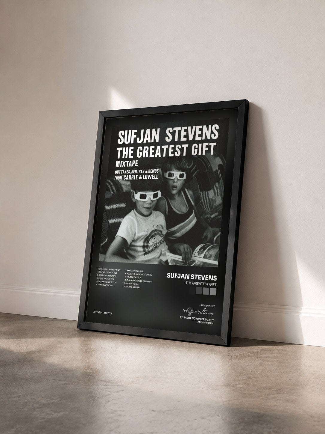 #noir Tableau de l'album The Greatest Gift de Sufjan Stevens vu de trois quarts, cadre noir