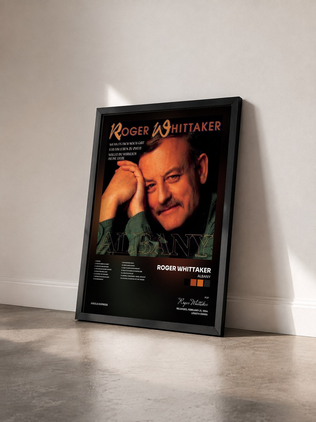 #noir Tableau de l'album Albany de Roger Whittaker vu de trois quarts, cadre noir