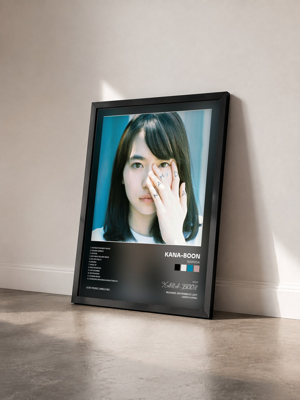 #noir Tableau de l'album NAMiDA de KANA-BOON vu de trois quarts, cadre noir