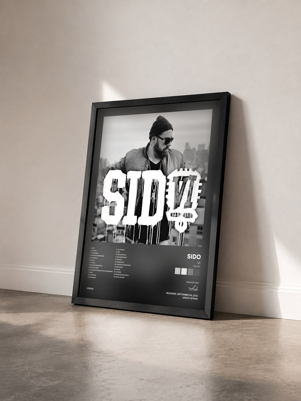 #noir Tableau de l'album VI (Deluxe) de Sido vu de trois quarts, cadre noir