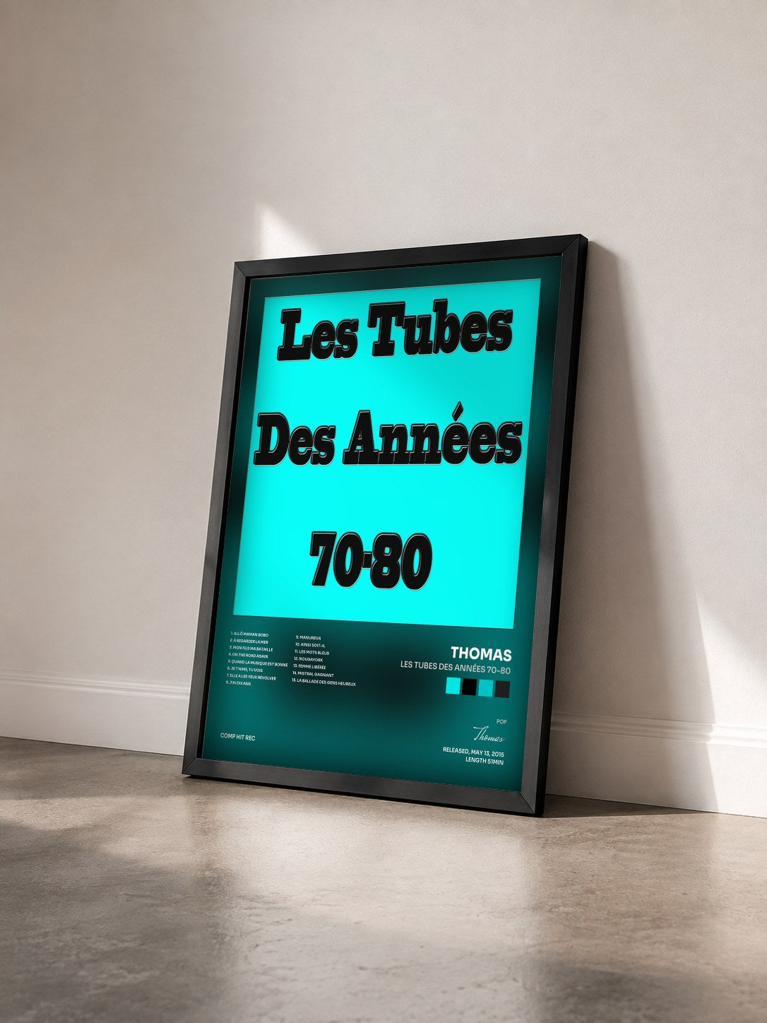 #noir Tableau de l'album Les tubes des années 70-80 de Thomas vu de trois quarts, cadre noir
