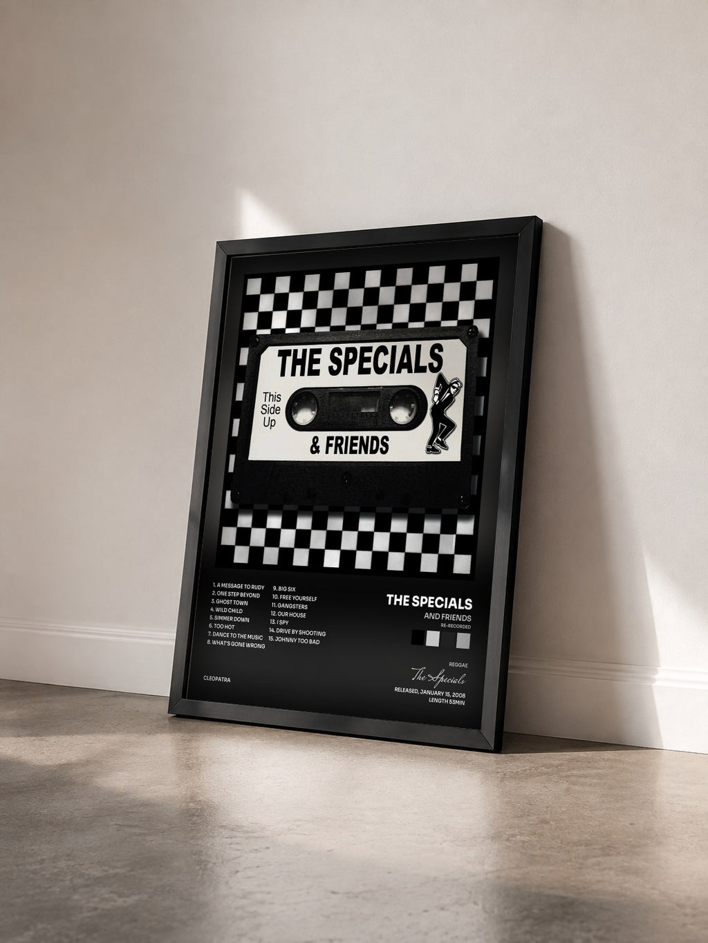 #noir Tableau de l'album And Friends (Re-Recorded) de The Specials vu de trois quarts, cadre noir