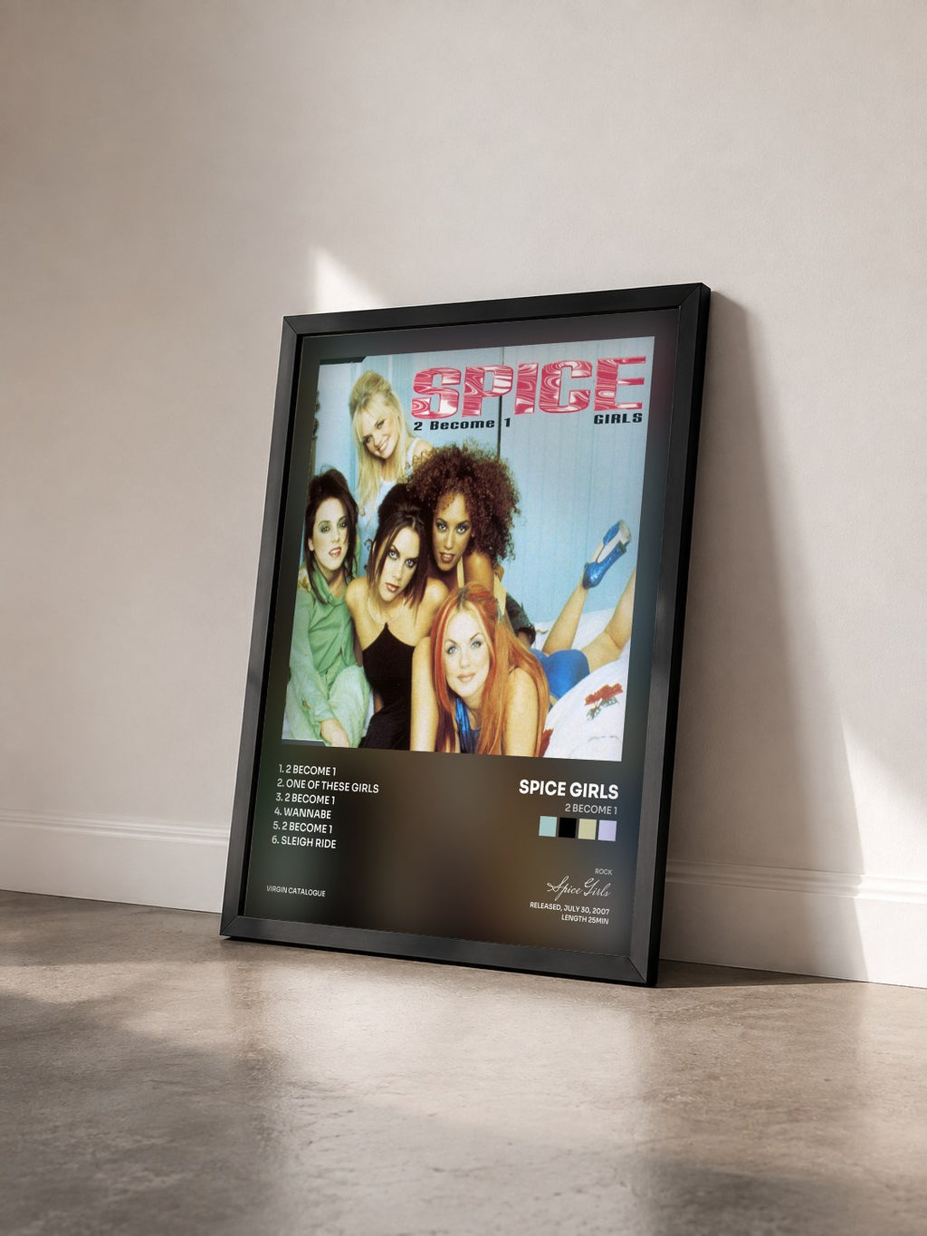 #noir Tableau de l'album 2 Become 1 de Spice Girls vu de trois quarts, cadre noir