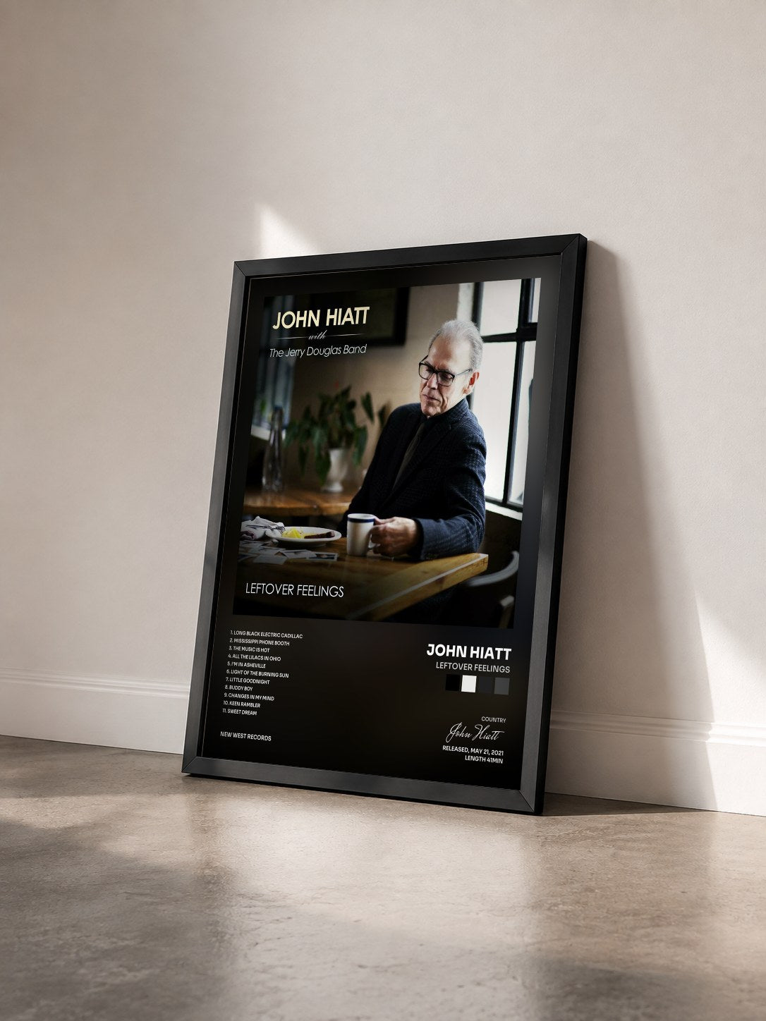 #noir Tableau de l'album Leftover Feelings de John Hiatt vu de trois quarts, cadre noir