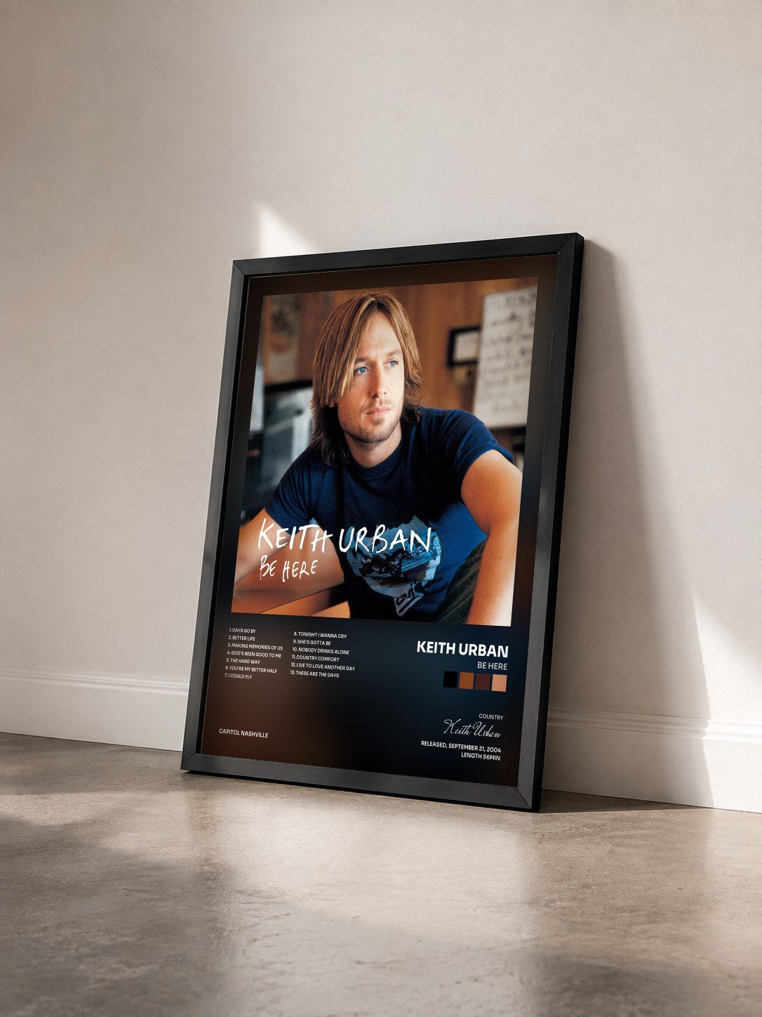 #noir Tableau de l'album Be Here de Keith Urban vu de trois quarts, cadre noir