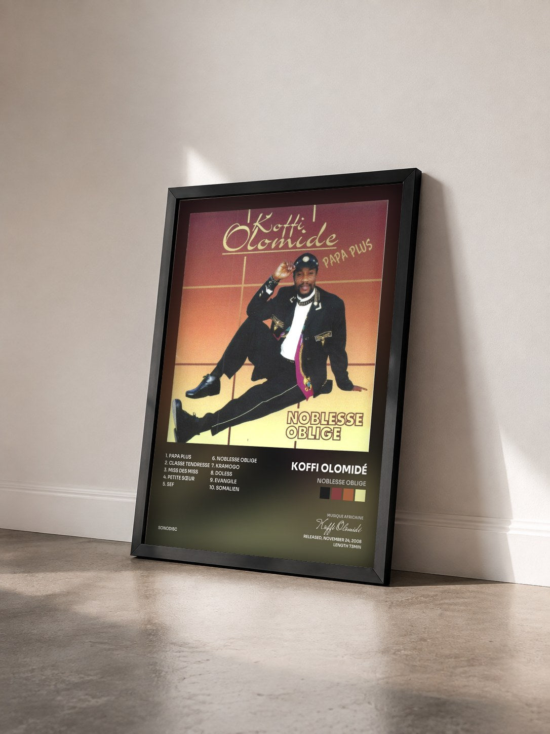 #noir Tableau de l'album Noblesse oblige de Koffi Olomidé vu de trois quarts, cadre noir