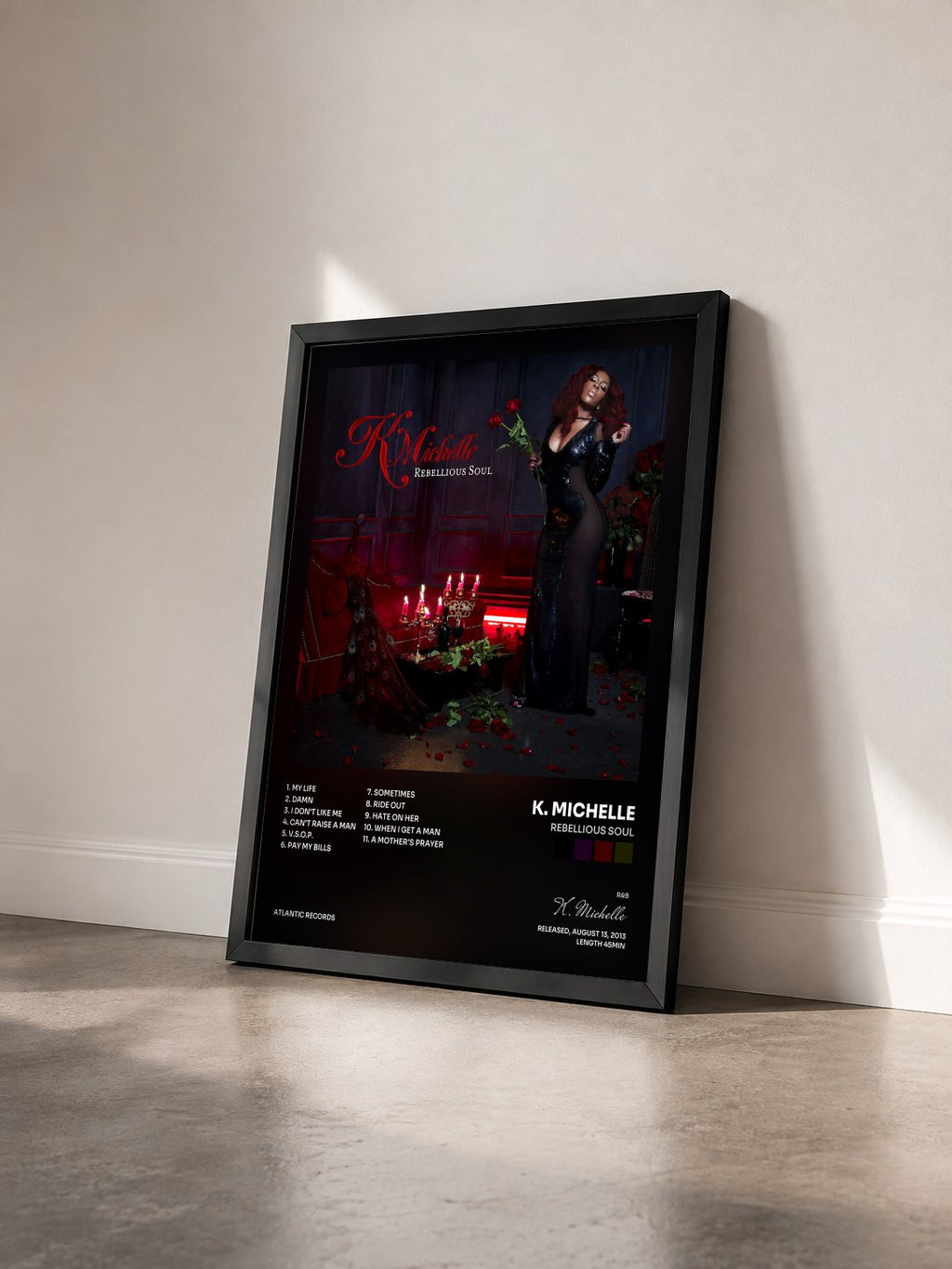 #noir Tableau de l'album Rebellious Soul de K. Michelle vu de trois quarts, cadre noir
