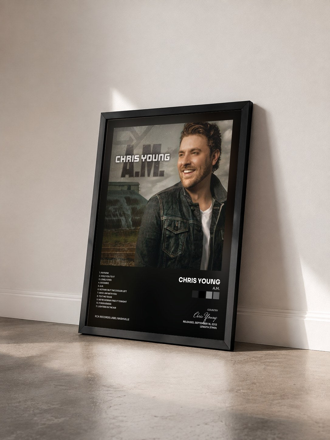 #noir Tableau de l'album A.M. de Chris Young vu de trois quarts, cadre noir