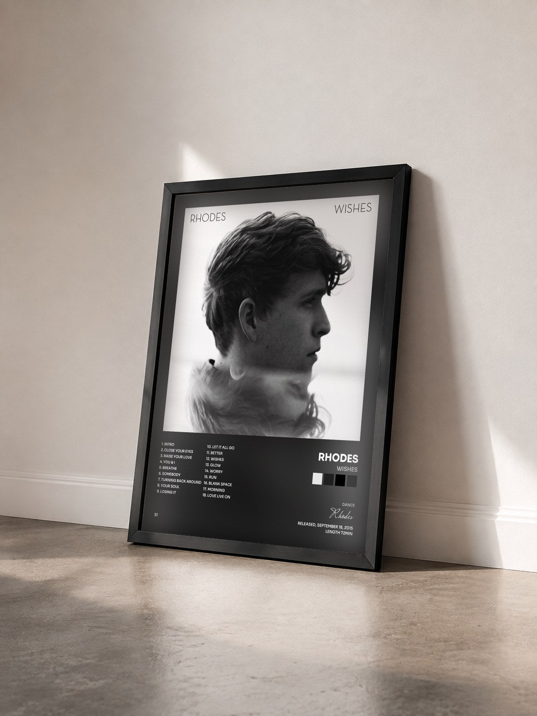 #noir Tableau de l'album Wishes de Rhodes vu de trois quarts, cadre noir