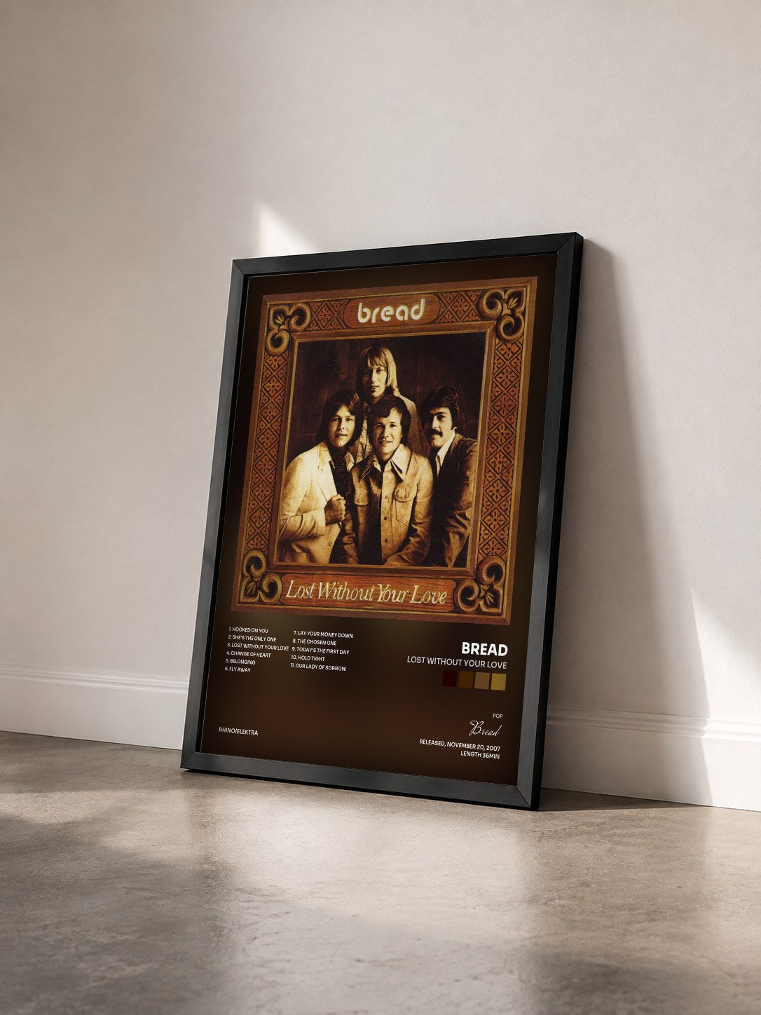#noir Tableau de l'album Lost Without Your Love de Bread vu de trois quarts, cadre noir