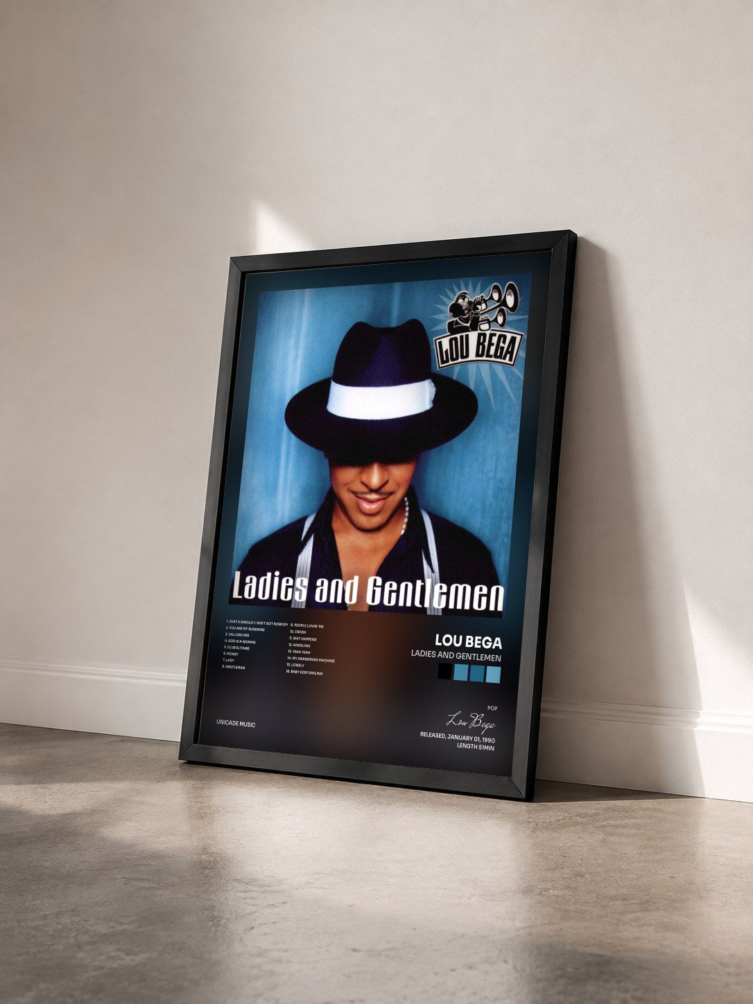 #noir Tableau de l'album Ladies And Gentlemen de Lou Bega vu de trois quarts, cadre noir