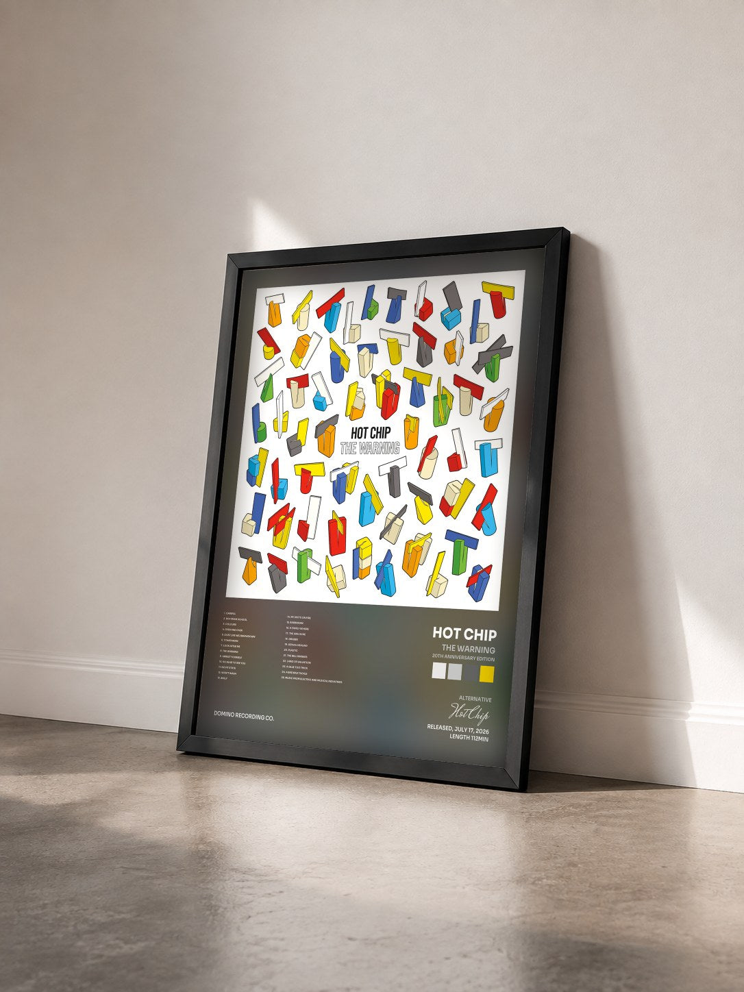 #noir Tableau de l'album The Warning (20th Anniversary Edition) de Hot Chip vu de trois quarts, cadre noir