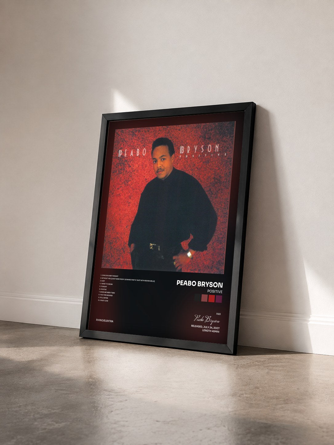#noir Tableau de l'album Positive de Peabo Bryson vu de trois quarts, cadre noir