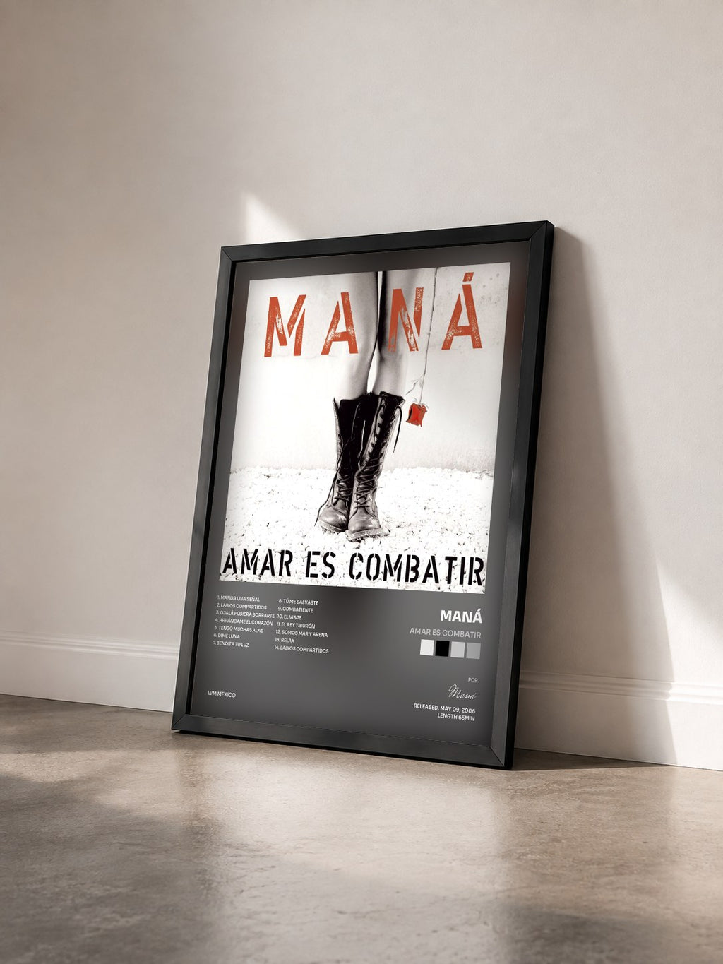 #noir Tableau de l'album Amar Es Combatir de Maná vu de trois quarts, cadre noir
