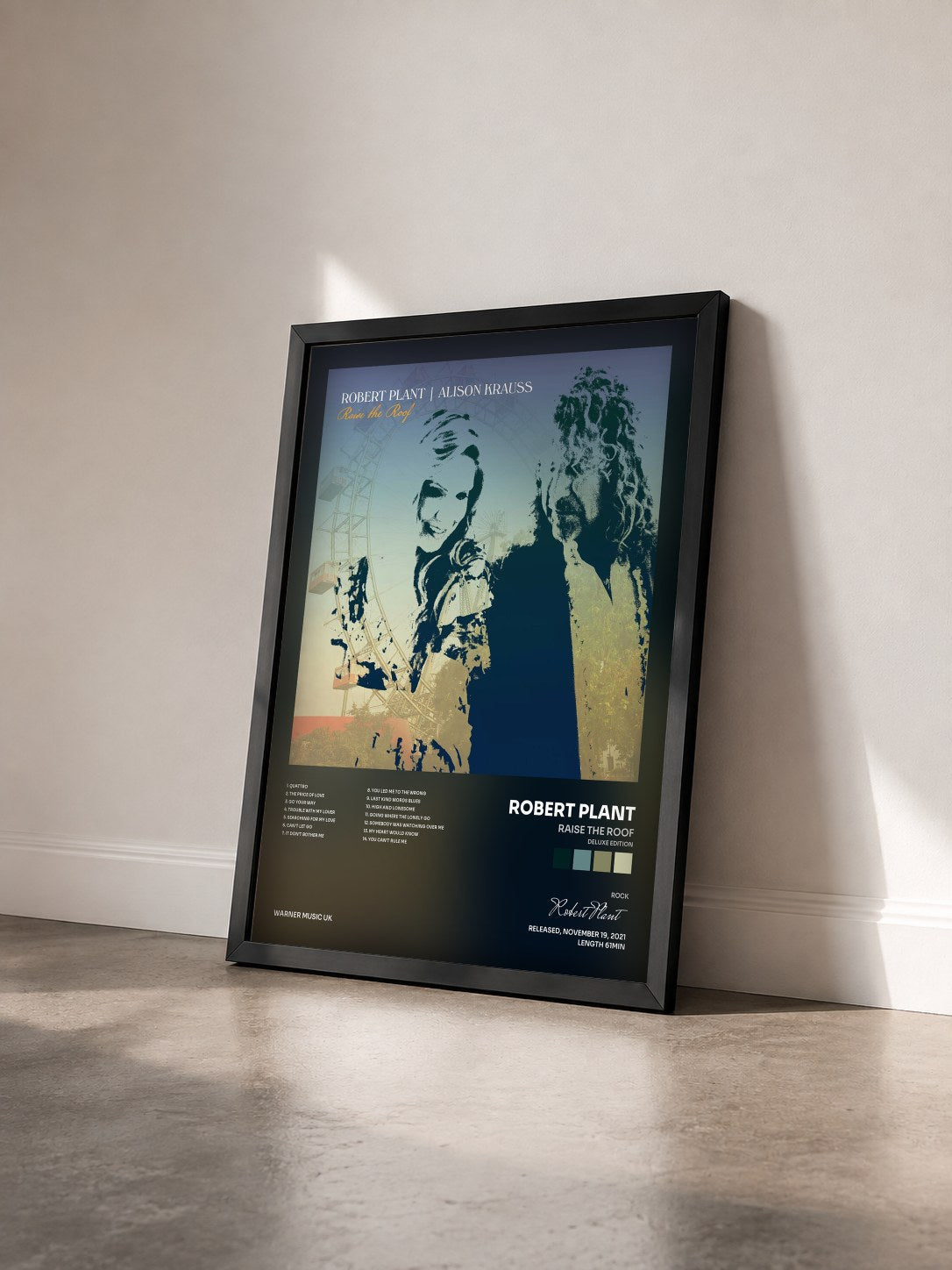 #noir Tableau de l'album Raise The Roof (Deluxe Edition) de Robert Plant vu de trois quarts, cadre noir