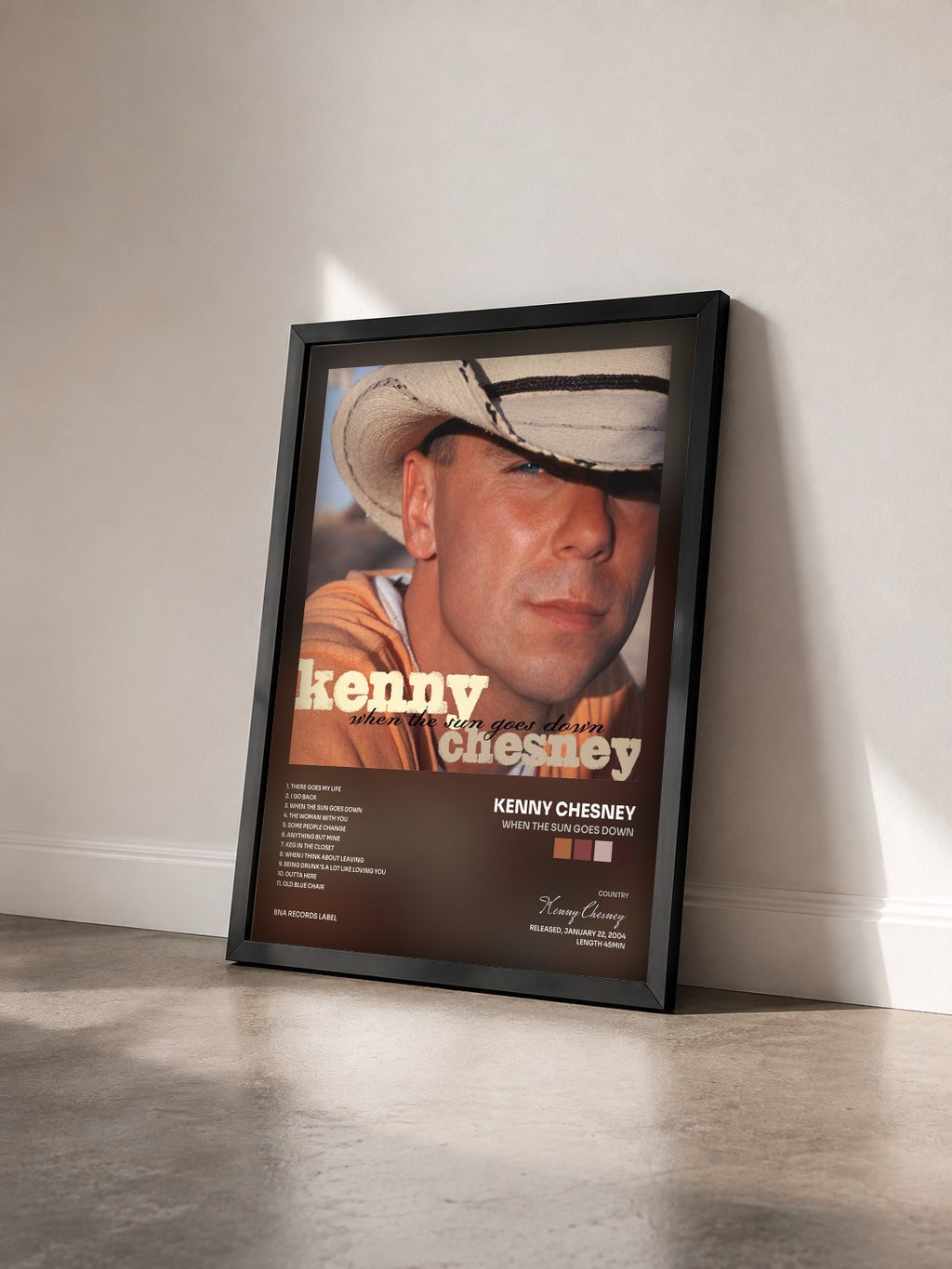 #noir Tableau de l'album When The Sun Goes Down de Kenny Chesney vu de trois quarts, cadre noir