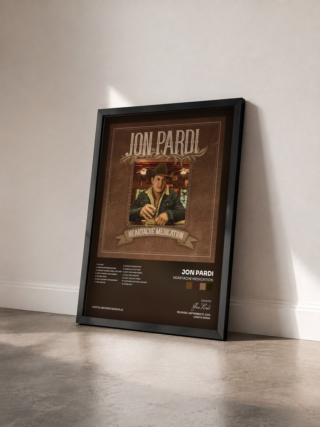 #noir Tableau de l'album Heartache Medication de Jon Pardi vu de trois quarts, cadre noir
