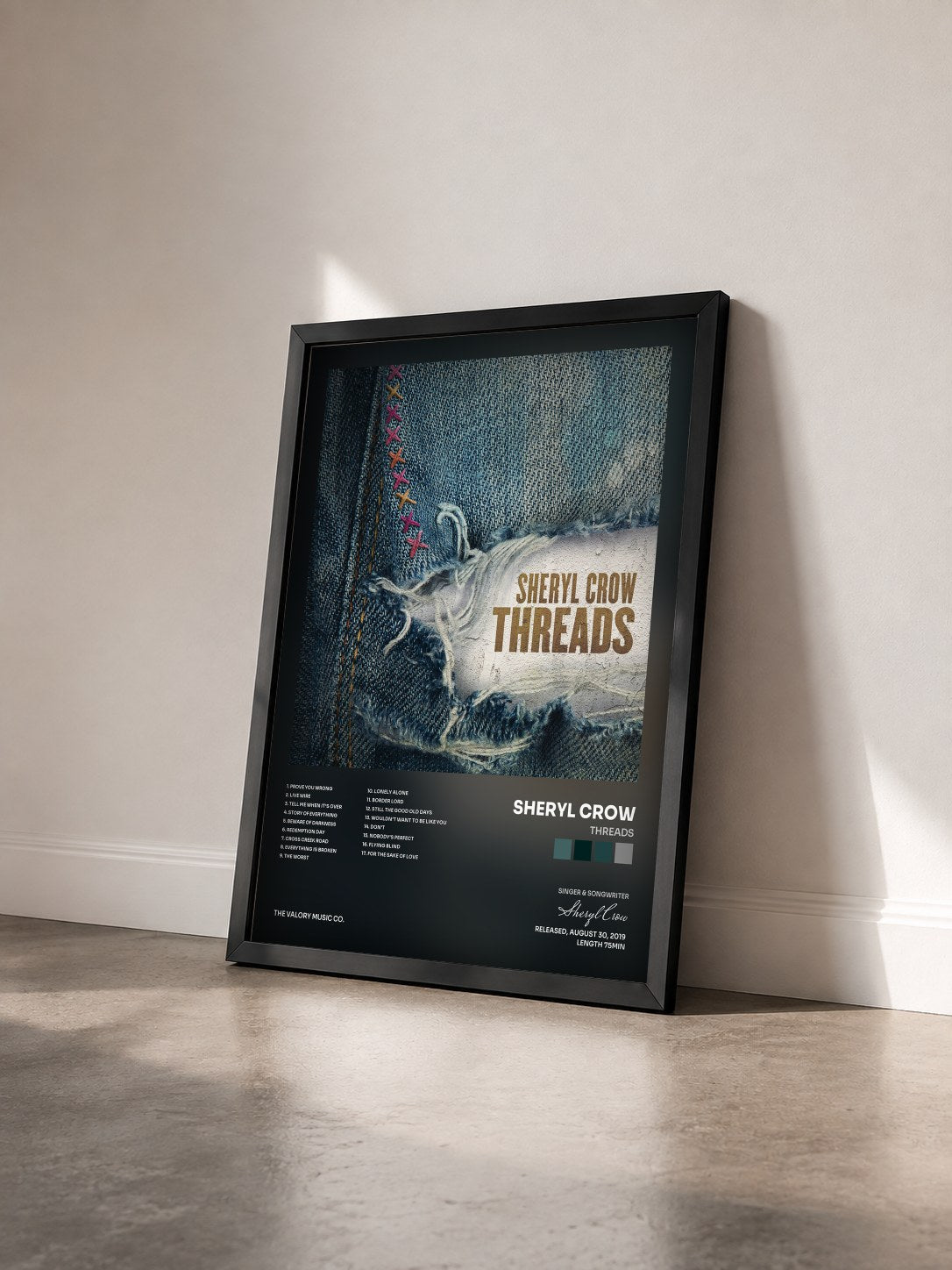 #noir Tableau de l'album Threads de Sheryl Crow vu de trois quarts, cadre noir