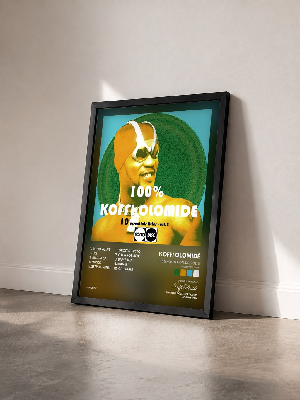 #noir Tableau de l'album 100% Koffi Olomide, vol. 2 (10 Essentials Titles) de Koffi Olomidé vu de trois quarts, cadre noir