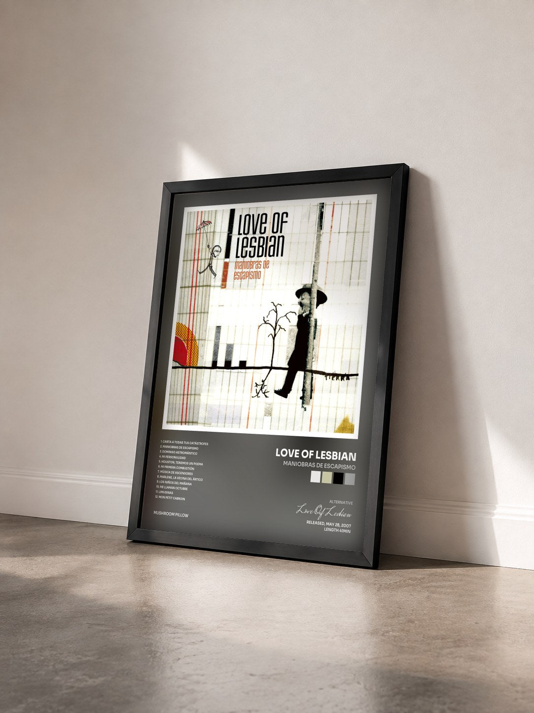 #noir Tableau de l'album Maniobras de Escapismo de Love Of Lesbian vu de trois quarts, cadre noir