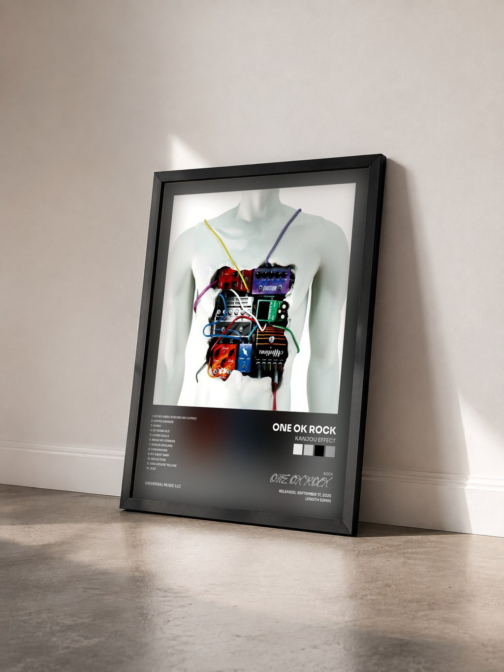 #noir Tableau de l'album Kanjou Effect de ONE OK ROCK vu de trois quarts, cadre noir