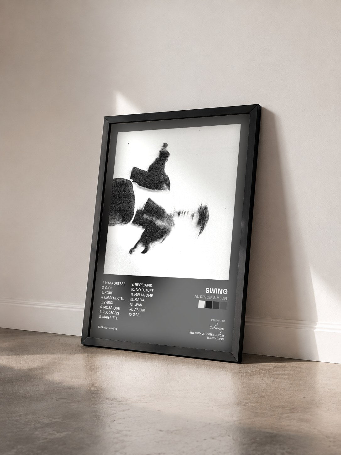 #noir Tableau de l'album AU REVOIR SIMEON de Swing vu de trois quarts, cadre noir