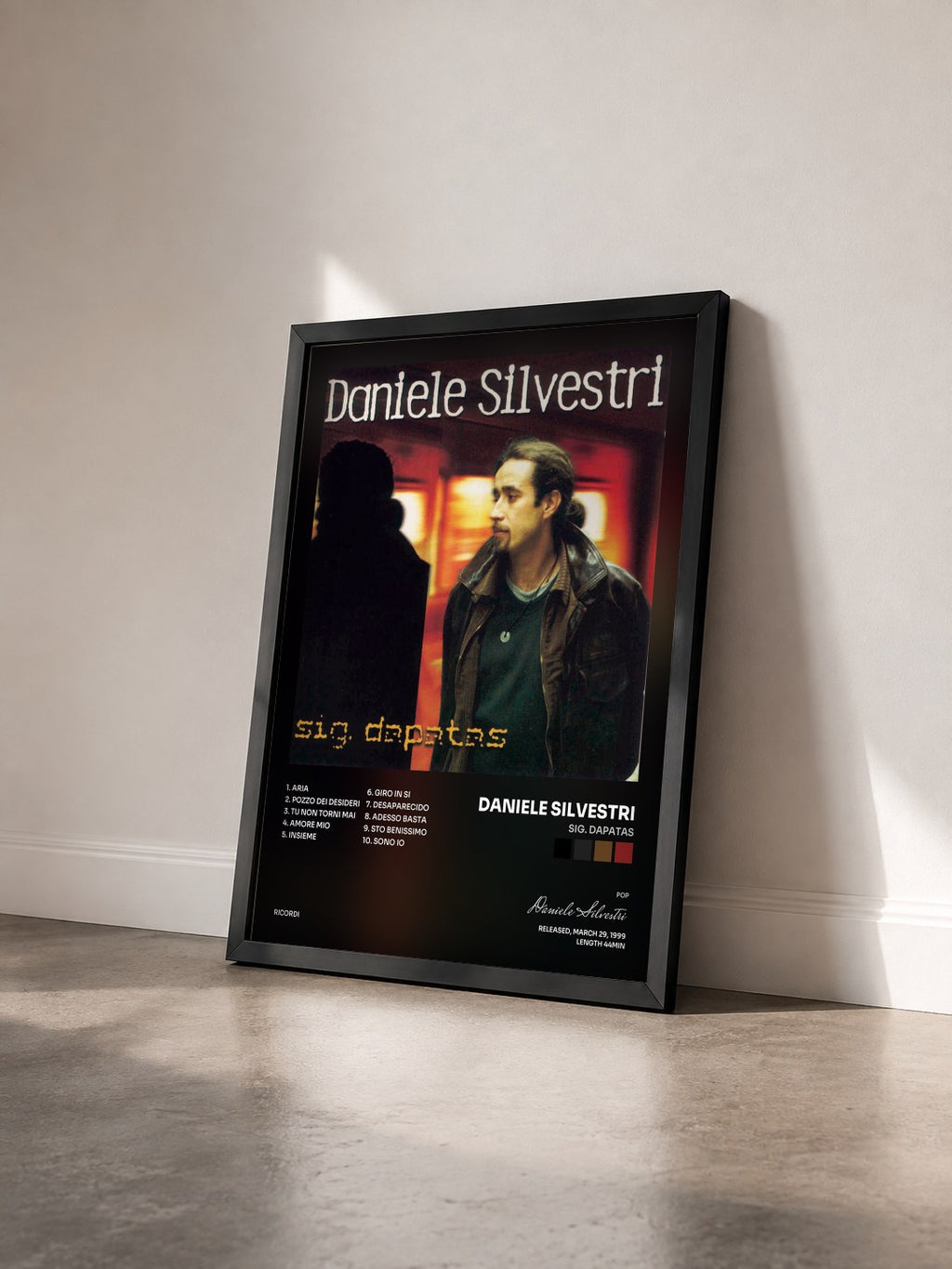 #noir Tableau de l'album Sig. Dapatas de Daniele Silvestri vu de trois quarts, cadre noir