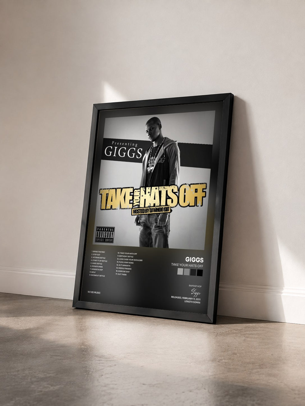 #noir Tableau de l'album Take Your Hats Off de Giggs vu de trois quarts, cadre noir