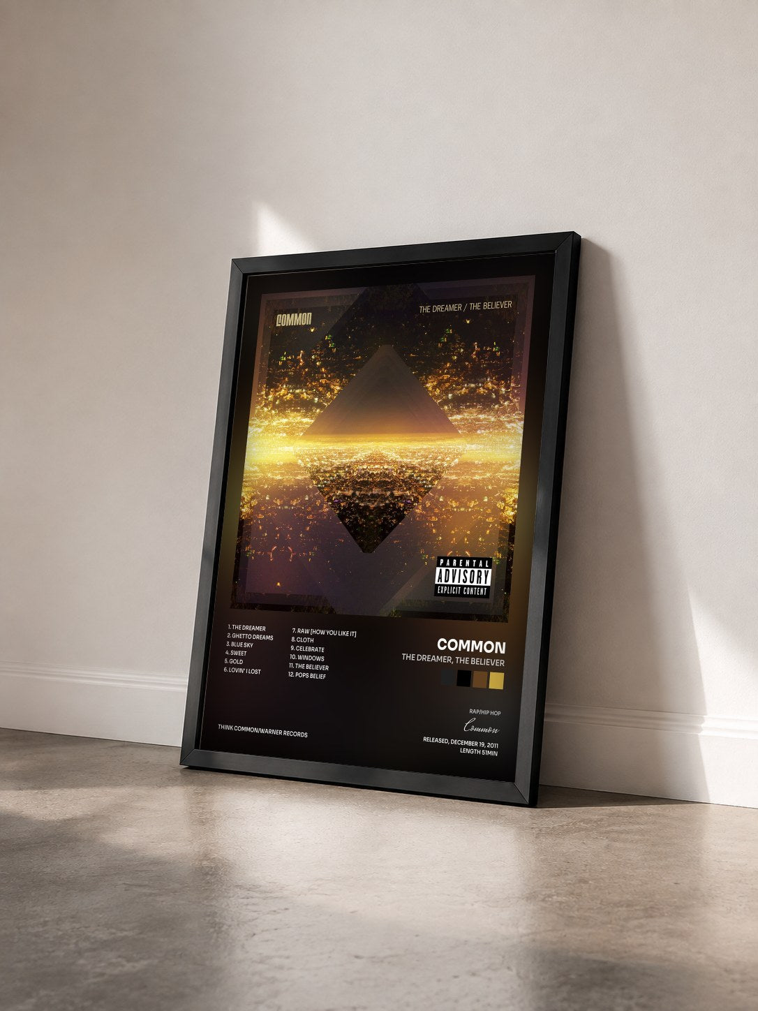 #noir Tableau de l'album The Dreamer, The Believer de Common vu de trois quarts, cadre noir