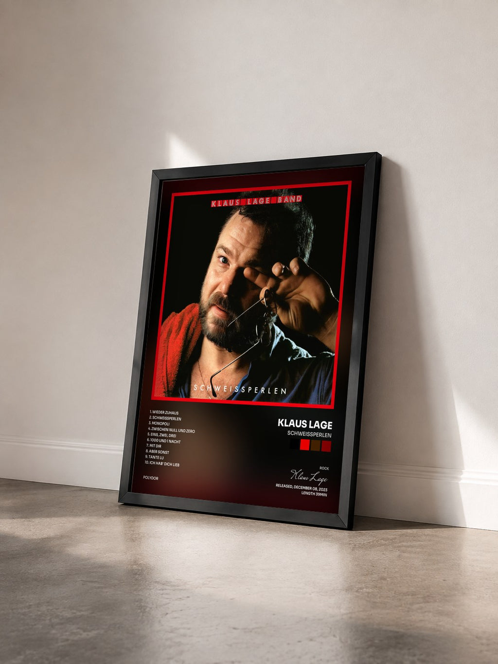 #noir Tableau de l'album Schweißperlen de Klaus Lage vu de trois quarts, cadre noir