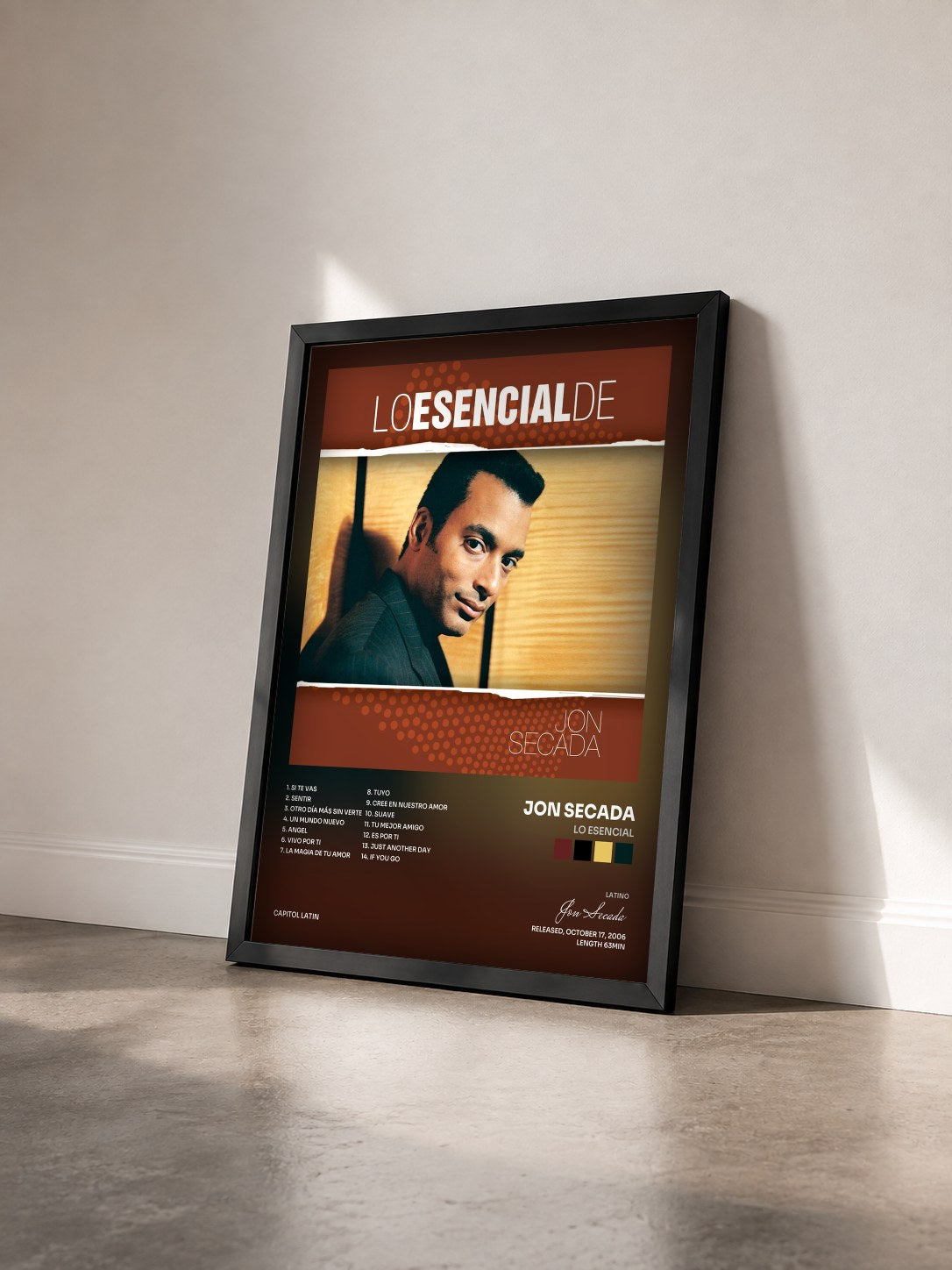 #noir Tableau de l'album Lo Esencial de Jon Secada vu de trois quarts, cadre noir