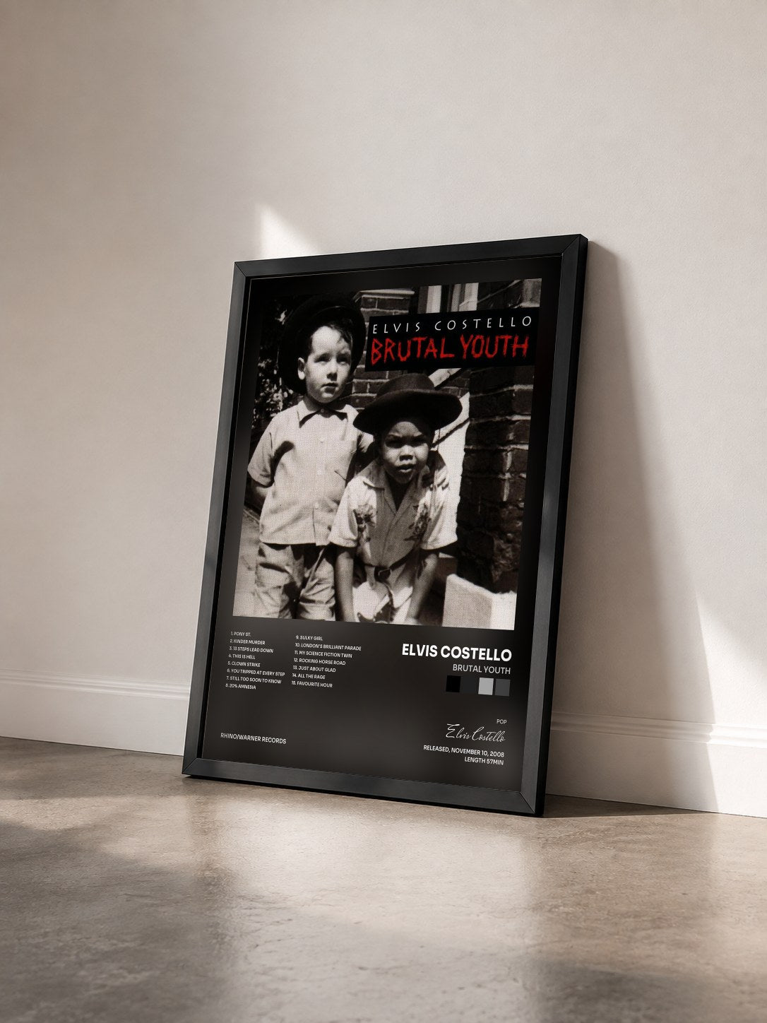 #noir Tableau de l'album Brutal Youth de Elvis Costello vu de trois quarts, cadre noir
