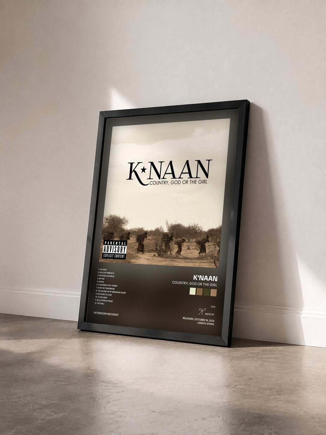 #noir Tableau de l'album Country, God Or The Girl de K'naan vu de trois quarts, cadre noir