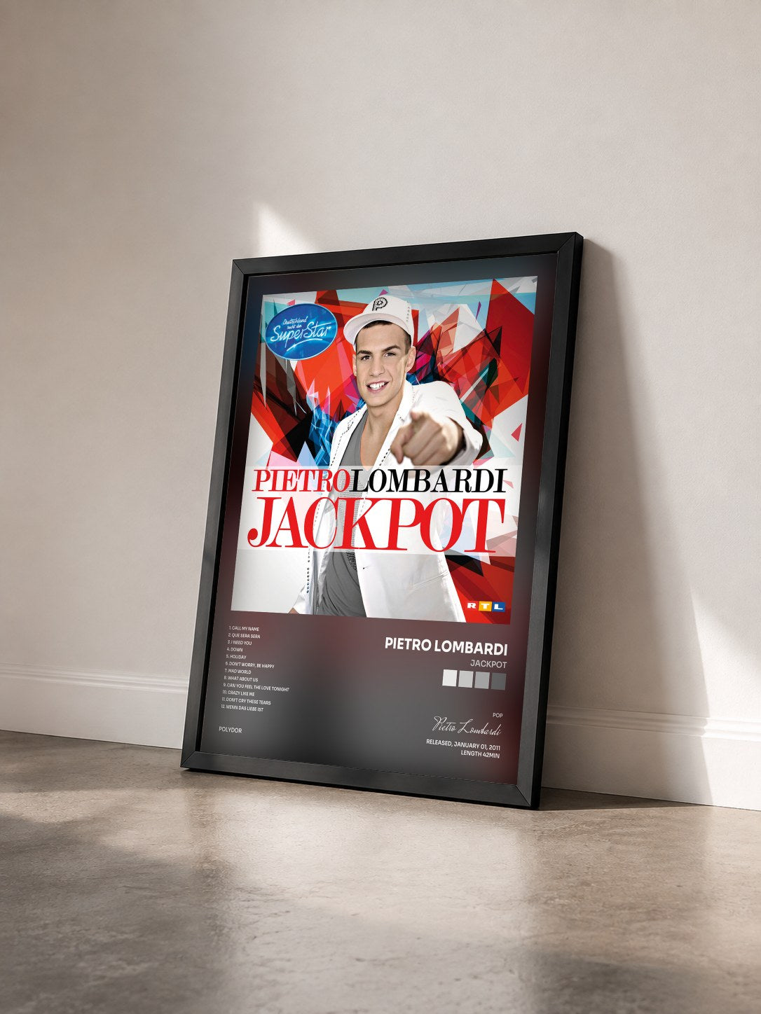 #noir Tableau de l'album Jackpot de Pietro Lombardi vu de trois quarts, cadre noir
