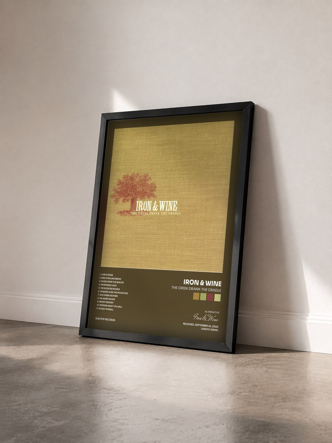 #noir Tableau de l'album The Creek Drank the Cradle de Iron & Wine vu de trois quarts, cadre noir