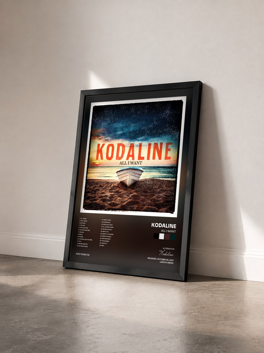 #noir Tableau de l'album All I Want de Kodaline vu de trois quarts, cadre noir