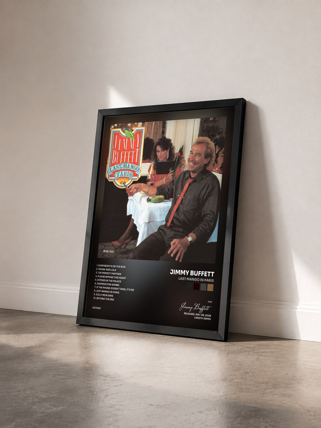 #noir Tableau de l'album Last Mango In Paris de Jimmy Buffett vu de trois quarts, cadre noir