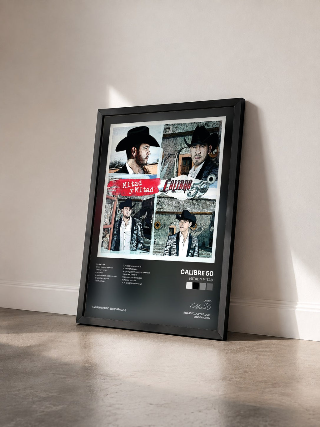 #noir Tableau de l'album Mitad Y Mitad de Calibre 50 vu de trois quarts, cadre noir