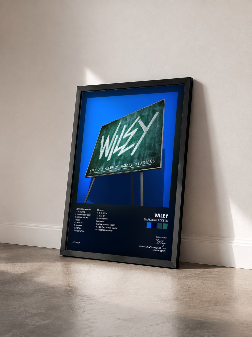 #noir Tableau de l'album Snakes & Ladders de Wiley vu de trois quarts, cadre noir