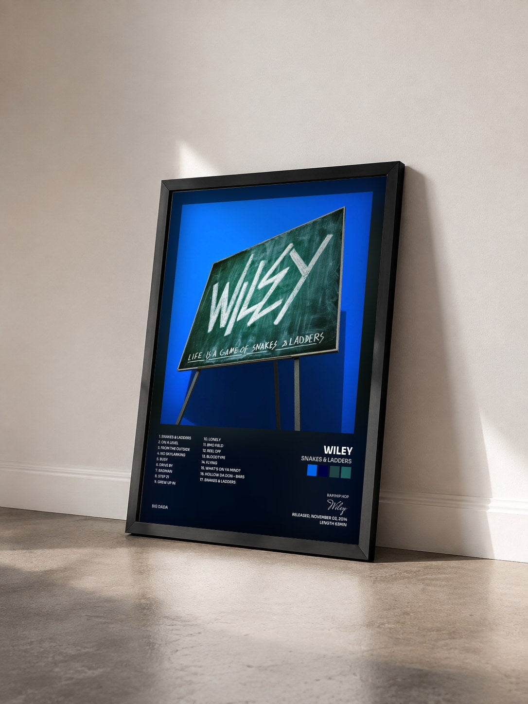 #noir Tableau de l'album Snakes & Ladders de Wiley vu de trois quarts, cadre noir