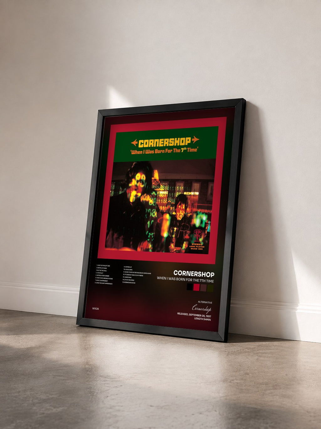 #noir Tableau de l'album When I Was Born for the 7th Time de Cornershop vu de trois quarts, cadre noir