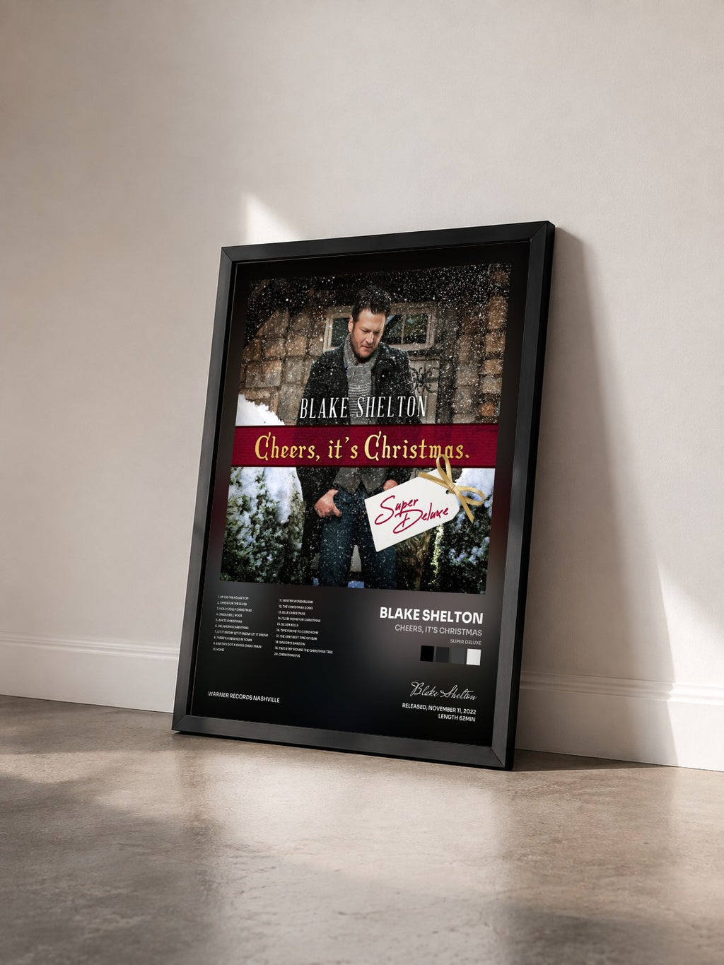 #noir Tableau de l'album Cheers, It's Christmas (Super Deluxe) de Blake Shelton vu de trois quarts, cadre noir