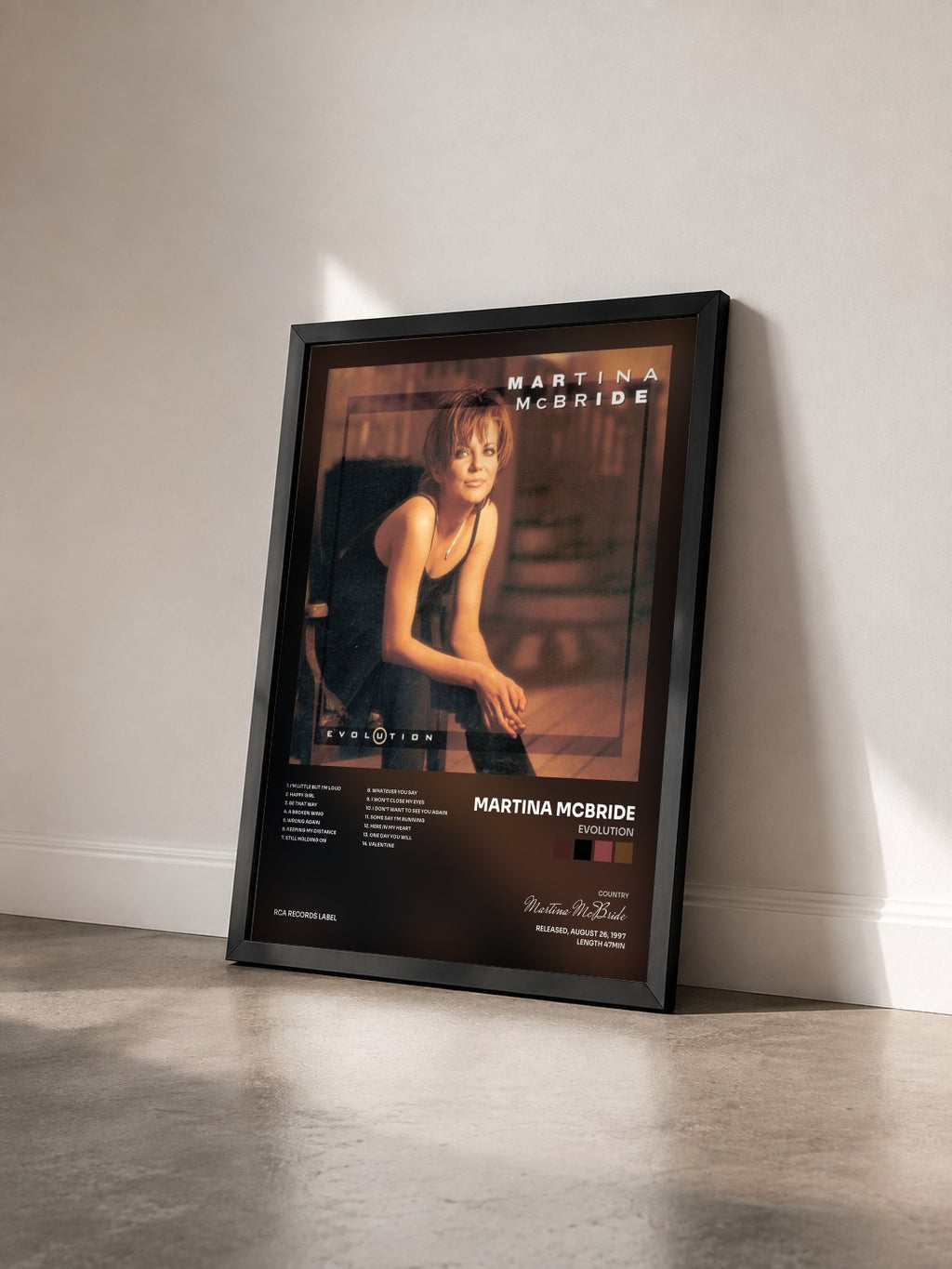 #noir Tableau de l'album Evolution de Martina McBride vu de trois quarts, cadre noir