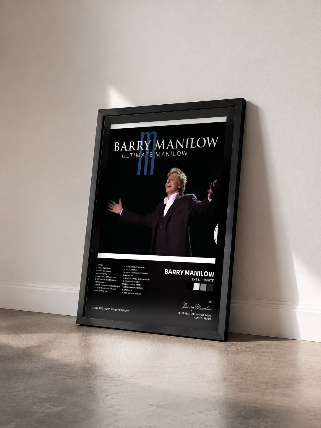 #noir Tableau de l'album The Ultimate de Barry Manilow vu de trois quarts, cadre noir