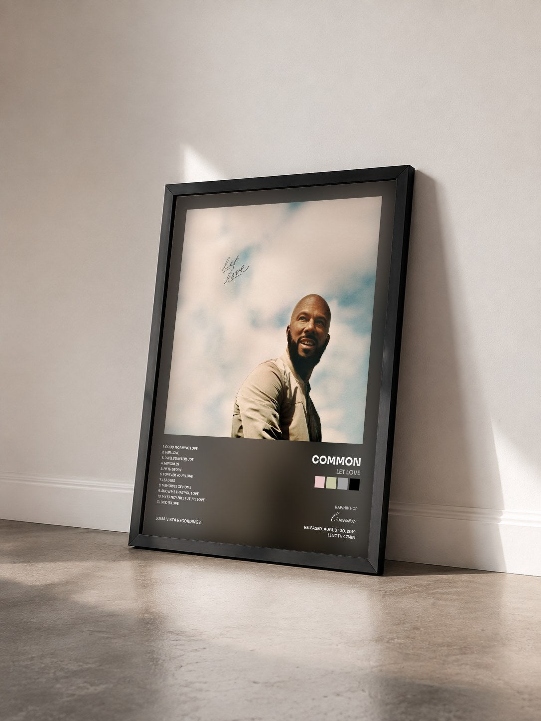 #noir Tableau de l'album Let Love de Common vu de trois quarts, cadre noir