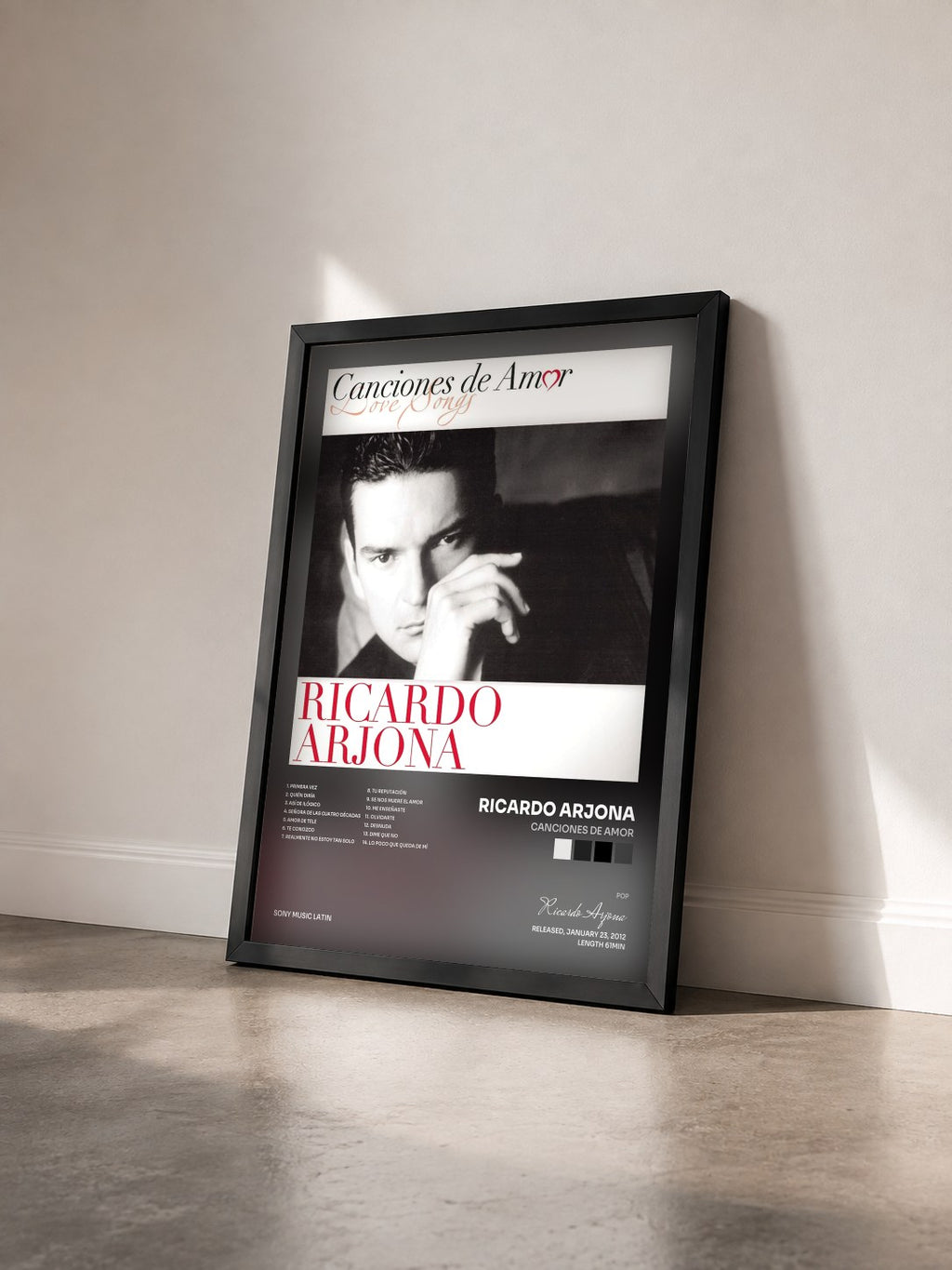 #noir Tableau de l'album Canciones De Amor de Ricardo Arjona vu de trois quarts, cadre noir
