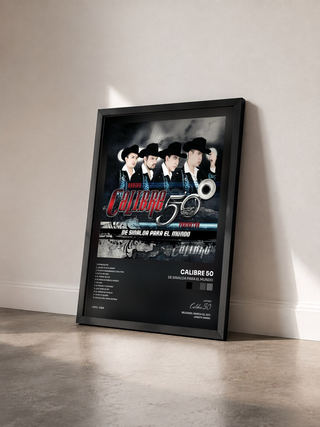 #noir Tableau de l'album De Sinaloa Para El Mundo de Calibre 50 vu de trois quarts, cadre noir